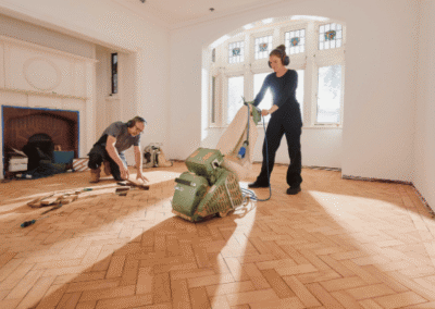 workers restoring wood floor