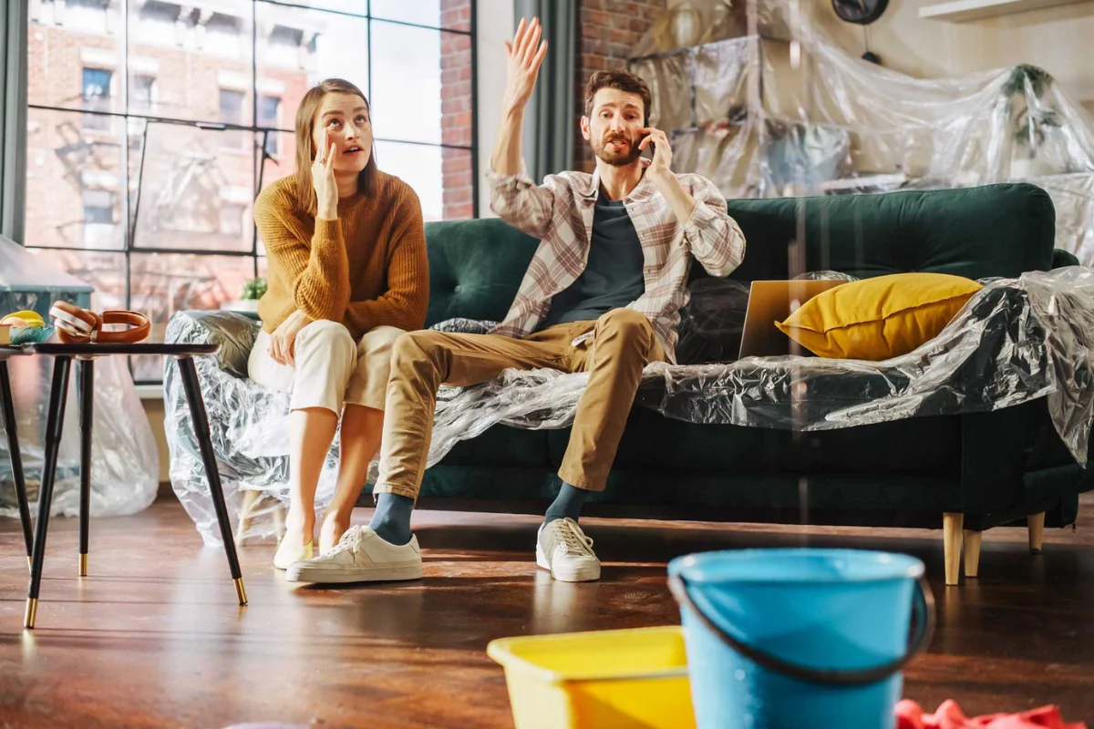 couple calling emergency water leak
