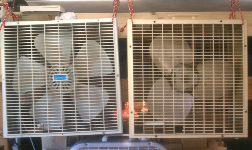 Box fans set up to ventilate and circulate air in an affected area