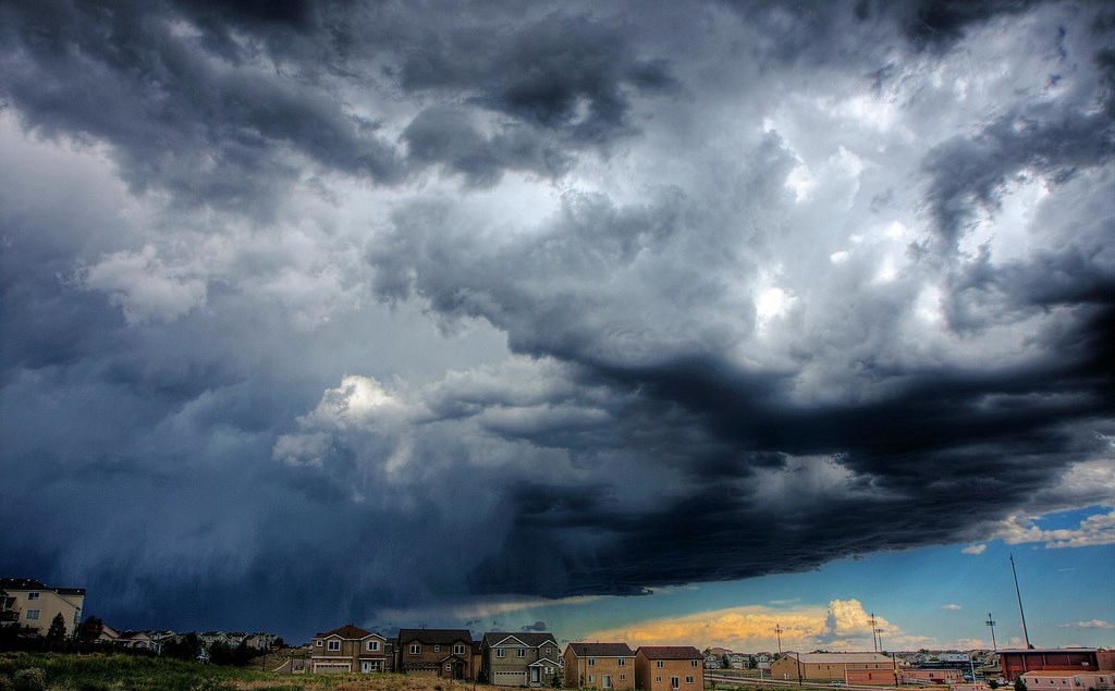 Severe storm clouds gathering over a residential neighborhood